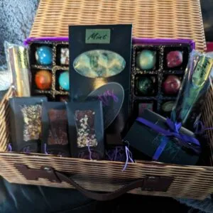 Handmade chocolate hamper presented in a wicker basket.