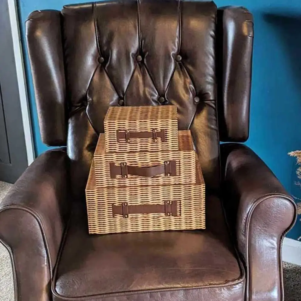 3 sizes of hamper boxes, not made of wicker so cheaper on a chesterfield. They are stacked together to show the difference in sizes