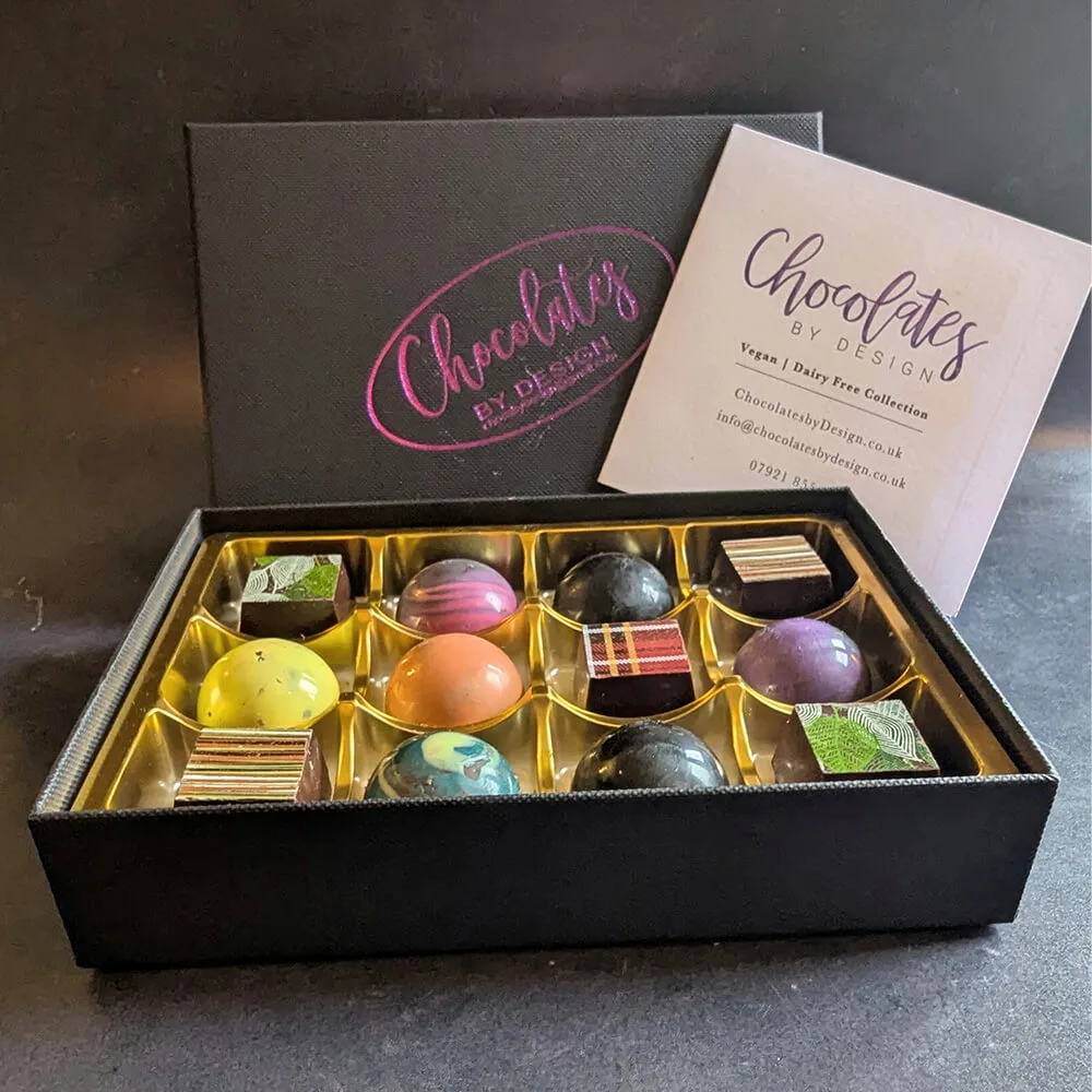 Assorted vegan artisan chocolates with decorative finishes