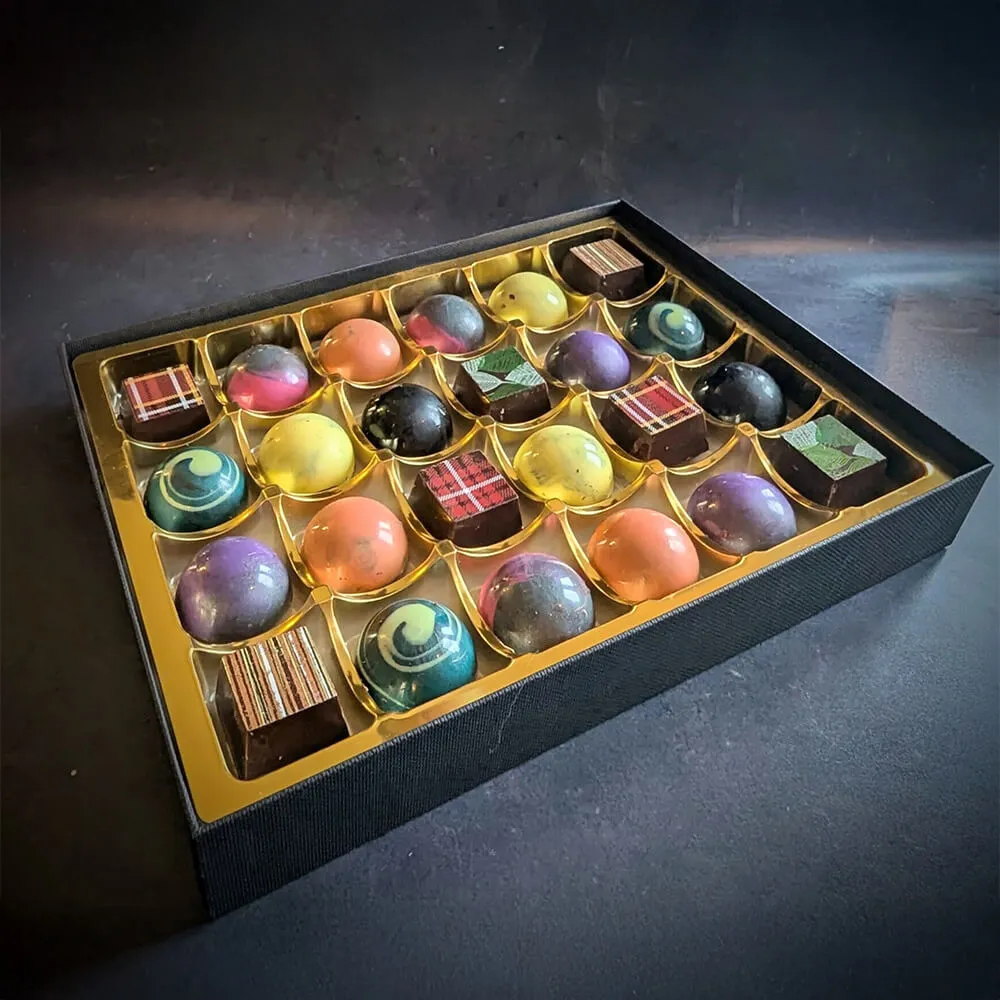 Cocktail-flavoured vegan chocolate truffles in luxury presentation
