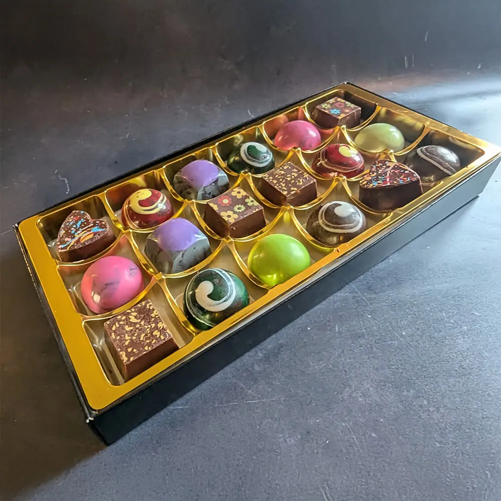 Dessert-inspired vegan chocolate assortment in elegant packaging