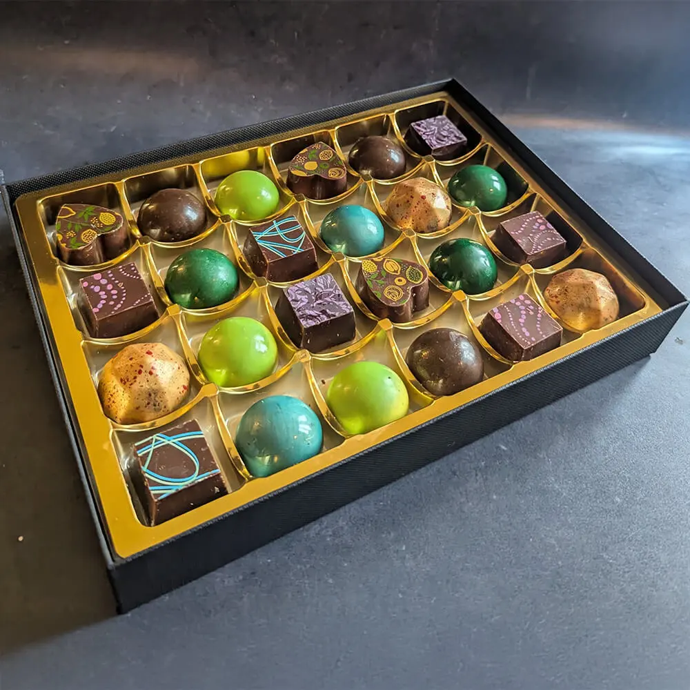 Luxury vegan chocolate assortment with colourful handcrafted truffles