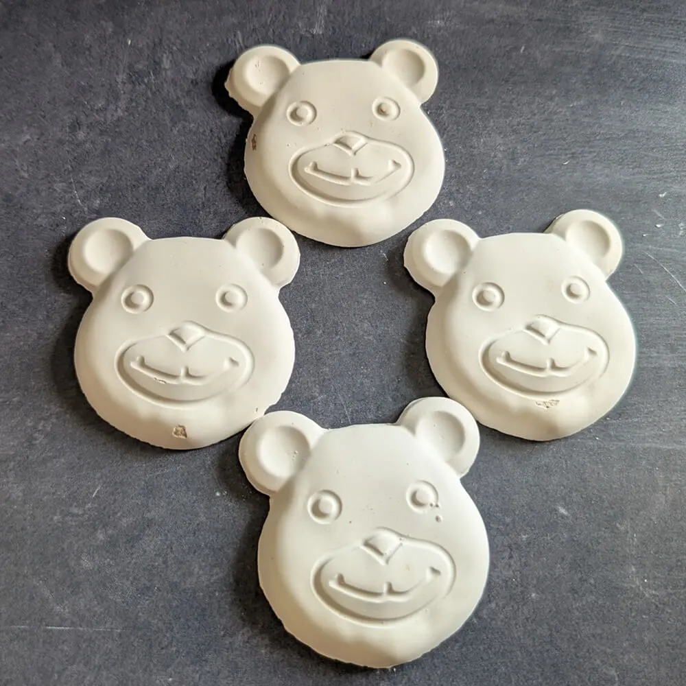 White chocolate teddy bear lollipops handcrafted by Chocolates by Design.