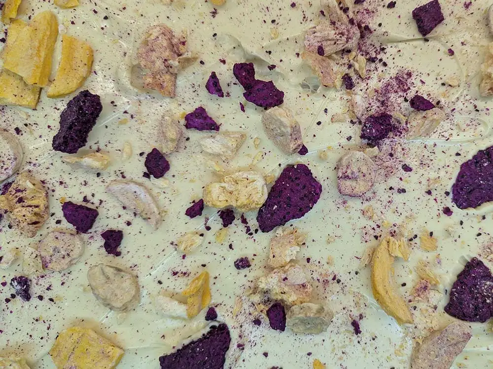 Handmade white chocolate bark with fruit and nuts by Chocolates by Design.